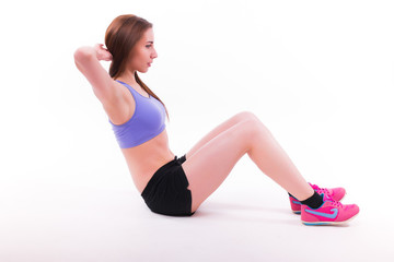 Young woman doing fitness exercise on white isolated background.