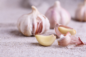 A clove of garlic and a few whole heads .