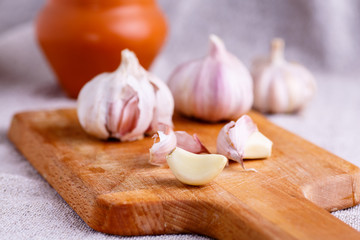 A clove of garlic and a few whole heads .