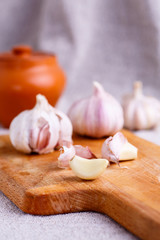A clove of garlic and a few whole heads .