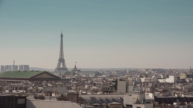 Famous Eiffel Tower and roofs of Paris - Full HD. Still shot of the Eiffel Tower and the roofs of Paris - 60fps