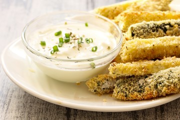 Zucchini fries and yogurt dip, selective focus