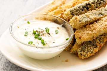 Zucchini fries and yogurt dip, selective focus