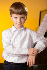 Boy piano. Piano player.