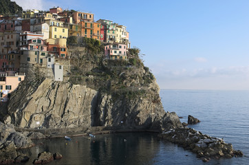 Fototapeta na wymiar A small town built on the rocks. Manarola. The Cinque Terre. Ita