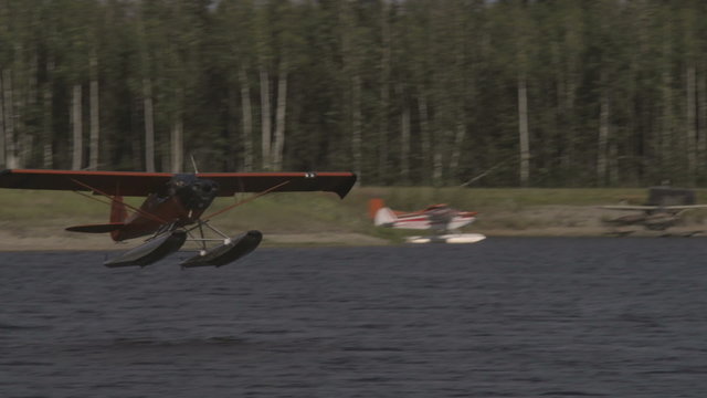 Fairbanks, Alaska, USA - JULY 2015. International Airport. The plane takes off from the water. 2 shot.