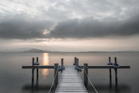 Wooden pier on the lake. Fog. Sunset in pastel colors. Long exposure. © patma145