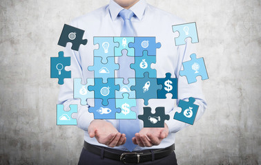 Man collecting a puzzle