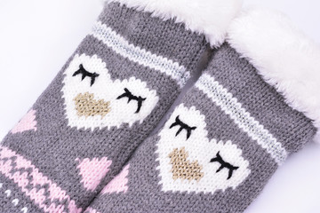 Wool knitted socks on white background