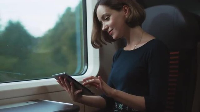 Girl discovers that She is winner During Traveling in Train. Shot on RED Cinema Camera.