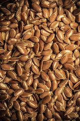 Brown raw flax seeds linseed bas background