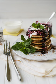Pancakes with jam and sour cream