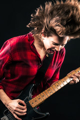 Obraz premium Model Red Flannel Shirt Electric Guitar Hair Flip
