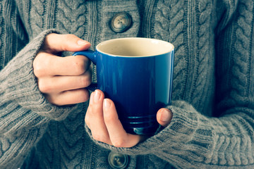 Cup in woman's hands