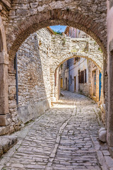Fototapeta na wymiar Narrow Old Street And Stone Buildings-Bale,Croatia