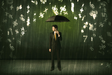 Businessman standing with umbrella and 3d numbers raining concep