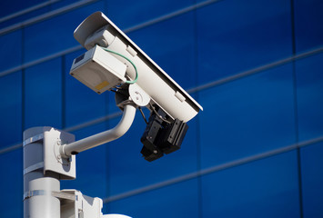 Surveillance camera in front of building