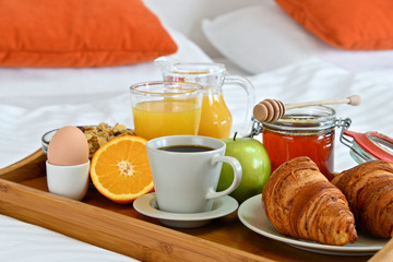 Breakfast in bed in hotel room.