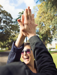 Girl celebrating success with a high five