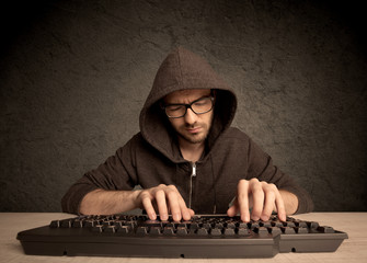 Computer geek typing on keyboard
