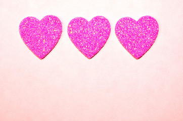 Glittering sparkling twinkling pink hearts.  Valentine's Day, Wedding, Anniversary, symbol of Love.