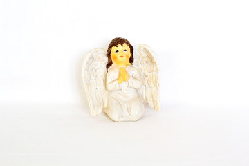 Figurine of angel on white background