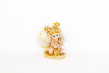 Figurines of angel on white background