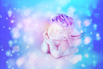 Figurines of angel on white background