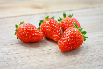 Fresh strawberries on wooden background