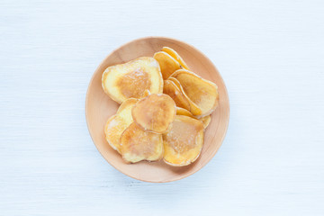 Dried potato slice and  coated with sugar