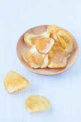 Dried potato slice and  coated with sugar