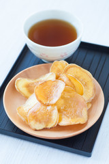 Dried potato slice and  coated with sugar