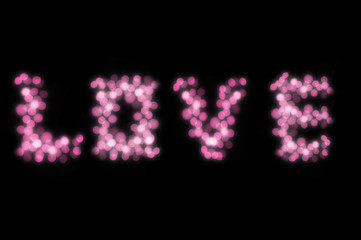 Love text by pink bokeh lights isolated on black background for