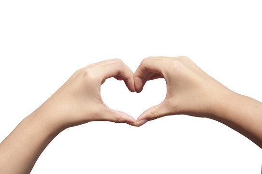 Female hands in the form of heart in white background. Hands in