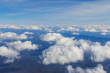 View of Beautiful Clouds and sky as seen through window of an aircraft