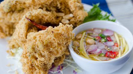 Crispy catfish salad with spicy sauce, Thai food