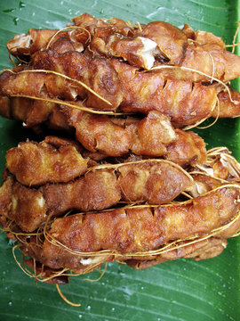 wet tamarind on banana leave