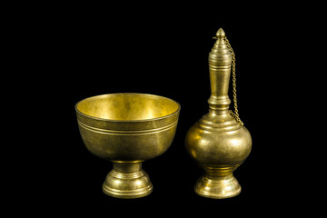 Fototapeta na wymiar Old brass ewer container pour water, Buddhism