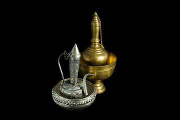 Fototapeta na wymiar Old silver and brass ewer container pour water, Buddhism