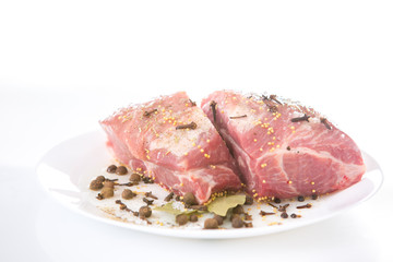 piece of raw meat with spices