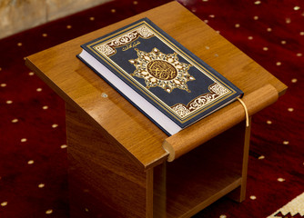 Islamic Koran put on wooden table inside mosque in Iraq