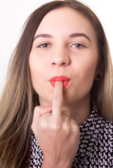Fototapeta premium close up sexy beautiful girl putting the middle finger in her mouth