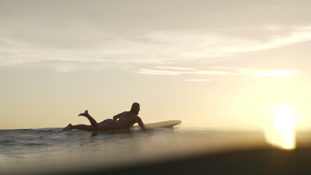 Slow Motion Surfer Girl Paddling At Sunset 