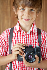 Happy kid with photo camera 