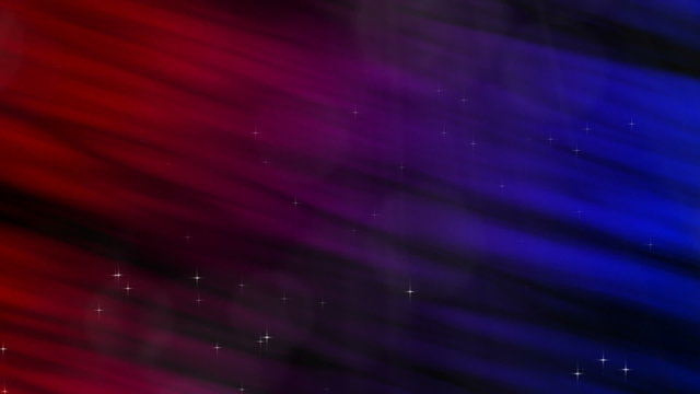 This perfectly seamless abstract loop features a colorful background of ruby red, violet purple, and cobalt blue with rising sparkling particles and subtle shafts of light.