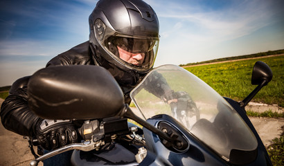 Biker racing on the road