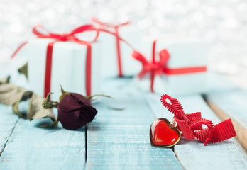 heart shaped pendant with rose and gift boxes