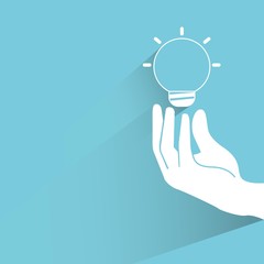 hand holding light bulb