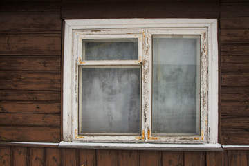 Naklejka na ściany i meble Window of an ancient wooden house, Poland