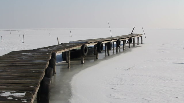 Dock and frozen lake in danube delta